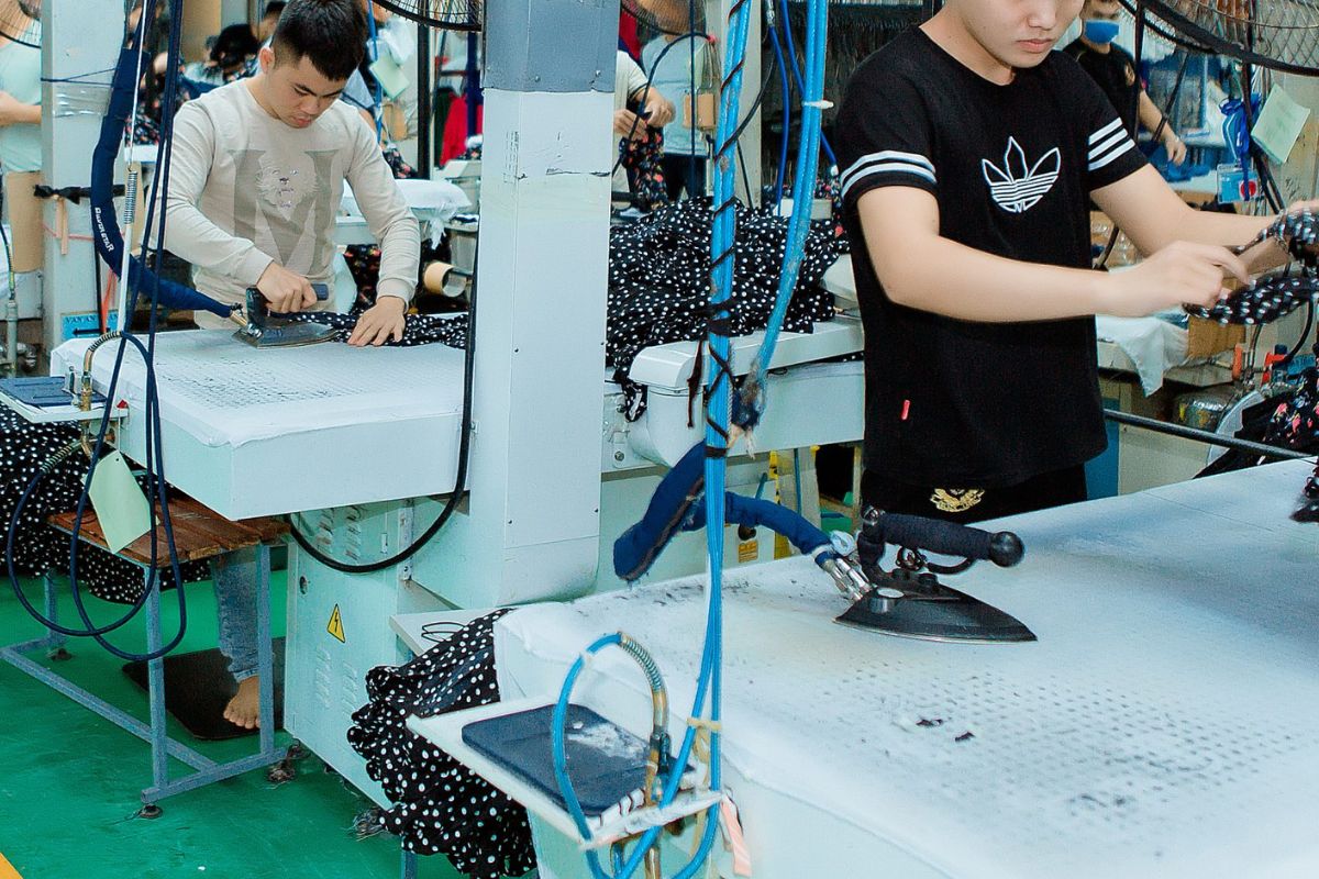 pressing finished clothes in kiara garments factory